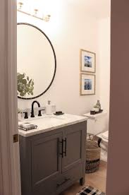 Marble bathroom with black hardware. Our Finished Little Powder Bath With Delta The House Of Silver Lining