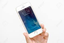 Insert in your phone the sim card and turn your device on. A Womans Hand Holding An Iphone 5s Close Up Shot Of Her Hand And The Iphone Homescreen The Cellular Phone Is Produced By Apple Computer Inc Stock Photo Picture And Royalty Free Image