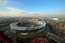 Aerial shot of the west ham football stadium next to an olympic court in the city of london, england. London 2012 Building The London Olympic Stadium S New Roof Architecture Of The Games