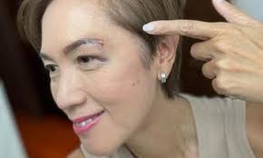 Minister Josephine Teo gets 'orh bak kak' after 'absent-mindedly' walking  into glass door