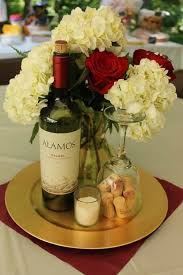 I think i'd like it better with a navy blue ribbon around the base of the tiers. Wine Themed Centerpiece Wine Theme Wedding Bridal Shower Wine Wine Themed Wedding Centerpieces