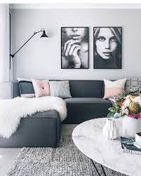 This modern living room showcases bright orange walls contrasted with a grey sofa, round coffee table, and pendant lights. Charcoal Couch Oh Eight Oh Nine Dark Grey Couch Living Room Grey Sofa Living Room Grey Couch Living Room