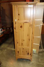 Not available for pickup and same day delivery. Tall Pine Storage Cabinet