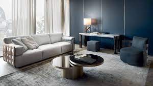 Leather, cowhide, or kilim?style modular cocktail ottomans brighten and add texture, pattern, and color. Space Coffee Tables