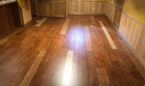 I love the way the epoxy looks, but there are minor imperfections, such as trapped lint and small bubbles, that keep the surface from looking like a perfect sheet of glass. Rustic Wood Flooring Concrete Wood Flooring Contractor