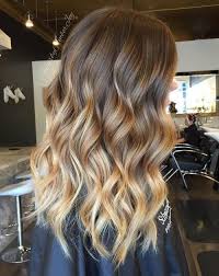 Chocolate brown hair with blonde highlights black to brown ombre hair the light brown to blonde ombre is a gorgeous contrast to the dark roots of this hairstyle. 29 Brown Hair With Blonde Highlights Looks And Ideas Southern Living