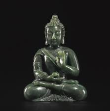 A Spinach Green Jade Figure Of Seated Buddha Carved Seated In Abhayamudra And Holding An Alms Bowl In Its Right Hand Wearing A Robe Asian Art Museum Vajra Art