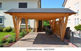 The modular structures feature a simplified design and integrated pv module mounting system designed. New Wooden Carport Front Residential Building Stock Photo Edit Now 1492723934