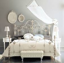 To denim blue toward the wroughtiron bed frames that is square. Fancy Wrought Rod Iron Beds Curved With Silver Color And Wall Mounted Mirror Also Small White Table And White Iron Beds Iron Bed Frame Wrought Iron Bed Frames