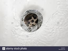 bathroom sink plug hole stock photo