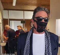 John Mcafee Claims He S Been Arrested In Norway For Wearing Lacy Thong On His Face Instead Of Mask Readsector
