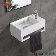What looks like one tall washbasin as actually a white vanity drawer and a white sink on top of it. Bathroom Wall Hung Small Solid Surface Stone Vanity Sink China Bathroom Sink Wall Hung Sink Made In China Com
