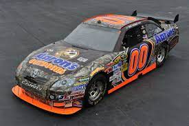 How do banked walls help cars go faster? 00 Camouflage Nascar Race Car Nascar Race Cars Nascar Cars Race Cars