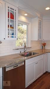 The White Koch Kitchen Cabinets Accented By A Dark Wood Finish Island And Richelieu Hardware Transitional Kitchen Design Kitchen And Bath Design Kitchen Design