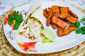 Top salad with dressing and serve with fish and fries. A Twist For Taco Tuesday Tilapia Fish Tacos With Sweet Potato Fries