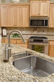 Beautiful tumbled travertine backsplash along with stainless steel appliances made a good match. Giallo Ornamental Granite Countertop With Stainless Steel Undermount Sink From United States Stonecontact Com