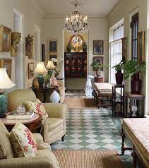 Traditional formal living room, with pairing 3 seater sofas, luxuorious coffee tables and complimentary artwork photo of a traditional open plan living room in london with white walls, light. Decorating With Antiques Set The Stage With Lighting