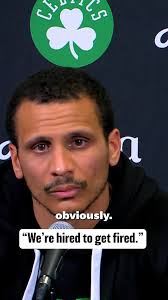 Joe Mazzulla reacts to the firing of...