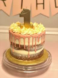 Scrape down the bowl, add yellow and gold. First Birthday Pink Gold Cake And Cupcakes The Baking Fairy