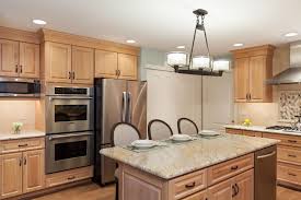 Use a clean rag to wipe the areas where you want to hang the lights and dry them off promptly. Contemporary Kitchen With Light Wood Cabinets And Kitchen Island Hgtv