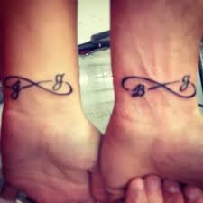 The font of the initial is very simple but looks perfect with the elaborated wings. 20 Beautiful Infinity Tattoo Designs For Men And Women