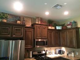 Use your kitchen cabinet tops as a space to stash things you have no room for elsewhere, like picnic baskets, decorative objects, or extra cutting boards. Ideas For Decorating Above Kitchen Cabinets In 2020 Kitchen Cabinets Decor Decorating Above Kitchen Cabinets Above Kitchen Cabinets