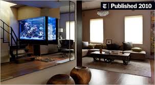 The tank itself is made from acrylic, but the table top is made from glass. Home Aquariums As Decorating Elements The New York Times