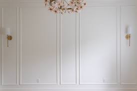 Apply adhesive to the backs of the baseboard pieces in a zigzag pattern and press them firmly into place. How To Install Wainscoting Home Design Lifestyle Jennifer Maune