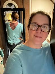 Folding and storing a sweater for the day