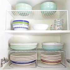 Shelf Risers If You Can T Create More Storage Space In Your Home Maximize The Space You Have With Shelf Risers In Your Kitchen Storage Spaces Shelves Storage