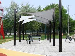 Beautiful Sail Cloth Patio Shades And Mounted On Fibreglass Columns Pillars With Black Pearl Metallic Paint Also Picnic Table Backyard Shade Patio Patio Shade