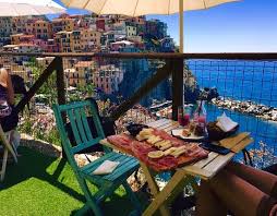 As you pass through downtown manarola, keep to your right as you reach the port and head up the ridge where you see the tables and umbrellas and hear the smashing wine glasses. Cinque Terre Full Day Tour