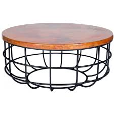 Pictured Here Is The Axel Coffee Table With Wrought Iron Base And Round Hammered Copper Table Top Copper Coffee Table Coffee Table Brass Drum Coffee Table