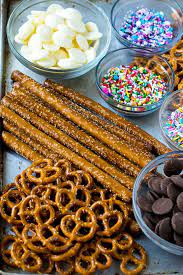 Pretzel Twists Pretzel Rods Candy Melts And Sprinkles On A Sheet Pan Chocolate Covered Pretzels Recipe Chocolate Covered Pretzels Chocolate Pretzel Rods