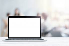 Laptop With Blank Screen Placed On White Wooden Table In Blurred People In Coffee Shop Or Restaurant Scroll Bar Wooden Tables Computer Table Design