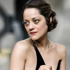 Marion Cotillard wearing an elegant black dress in a