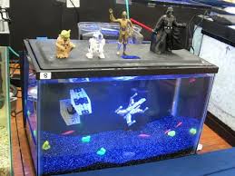 Star Wars Characters Stand Atop An Aquarium From A Galaxy Far Far Away The Space Like Interior Featur Fish Tank Decorations Aquarium Fish Tank Aquarium Decor