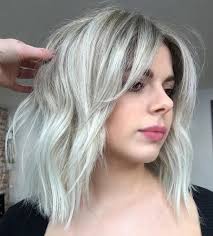 Platinum blonde with a rich burgundy root melt. 🍷🐚