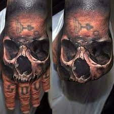 Like skull tattoos associate with fearless. 3d Realistic Skull Hand Tattoos For Guys Skull Hand Tattoo Hand Tattoos Skull Tattoo Design