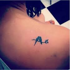 Apart from their impeccable beauty, the feathers also carry great symbolic significance, depending on which bird they come from. Black Love Bird Tattoo Novocom Top