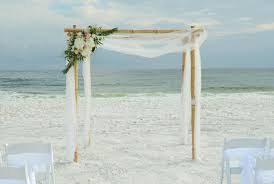 Offering all inclusive florida beach wedding packages. Simple All White Wedding Arbor Grayton Beach Florida Destination Beach Wedding Sunset Beach Weddings All White Wedding Beach Wedding Arch
