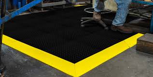 Modern floor covering in the form of rubber tiles and details of red, green and blue. Interlocking Floor Mats Anti Fatigue Rubber Floor Tiles De Flex Notrax