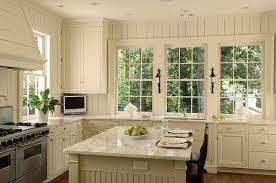 And if you have installed white beadboard kitchen cabinets we'd love to feature your project. Another View Of The Cozy White Kitchen Beadboard Kitchen Beadboard Kitchen Cabinets Antique White Kitchen