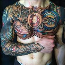 Shoulder armor tattoo with a lion etching. Top 93 Best Armor Tattoo Ideas 2021 Inspiration Guide