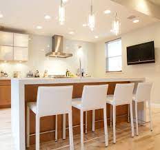 Sold separately.pendant lights give just the right amount of ambience over a rugged kitchen table.try hanging several along the table center to add character to a modern home or a fresh twist to your classic décor. 55 Beautiful Hanging Pendant Lights For Your Kitchen Island Kitchen Bar Lights Kitchen Bar White Bar Stools