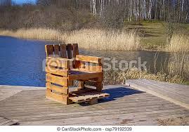 Pallet wood wall fun and unique project: Rustic Chair From Old Used Pallets On Wooden Deck Rustic Hand Crafted Chair Made From Wood Pallets On Wooden Deck Canstock