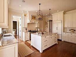 Popular white kitchen cabinets gleam with pizzazz, do you agree? Sherwin Williams Navajo White Sherwin Williams Antique White Kitchen Cabinets Antique White Kitchen Antique White Kitchen Cabinets White Kitchen Traditional