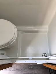The problem with smaller rvs is they don't always include a bathroom and shower. Retractable Shower Door For A Wet Bath