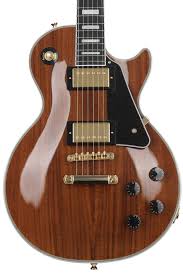 Epiphone les paul custom electric guitarthe new les paul custom is part of epiphone's inspired by gibson collection and honors the 1950s classic designed by mr. Epiphone Les Paul Custom Koa Natural Sweetwater