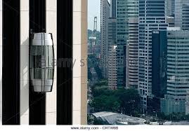 The External Lift Elevator On The Pan Pacific Hotel In Singapore The Central Financial District Is In The Background Glass Elevator Pacific Hotel Elevation